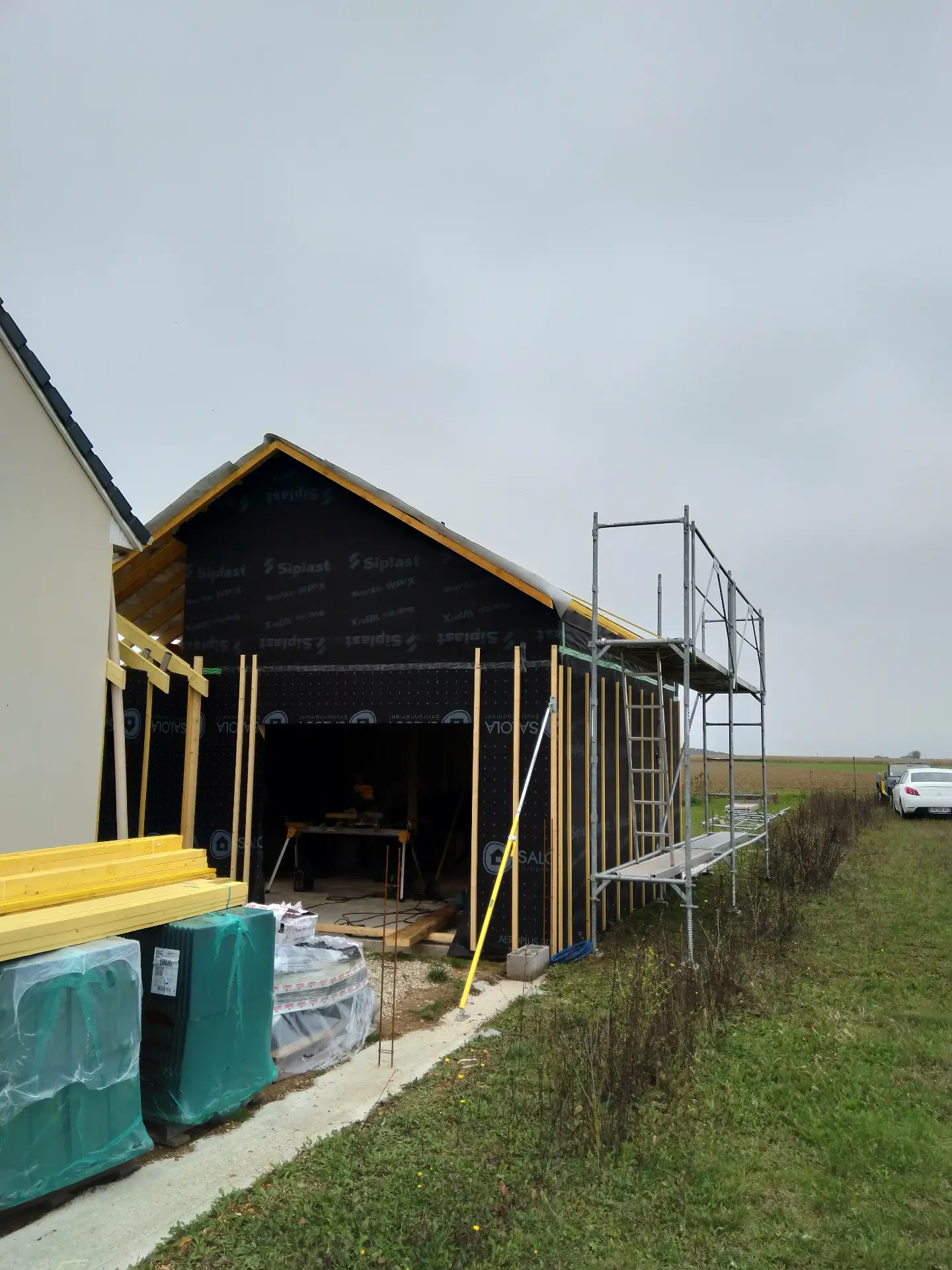 Construction ossature bois avec isolation toiture performante